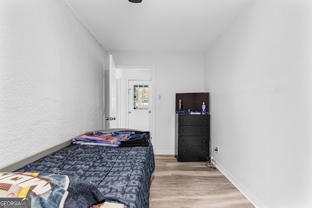 bedroom with hardwood / wood-style floors