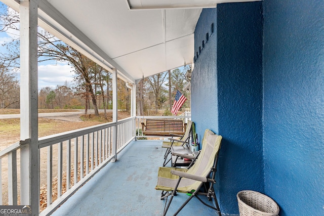 balcony featuring a porch