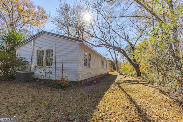 view of home's exterior with cooling unit