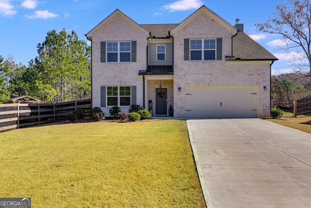 view of front facade with a garage and a front lawn