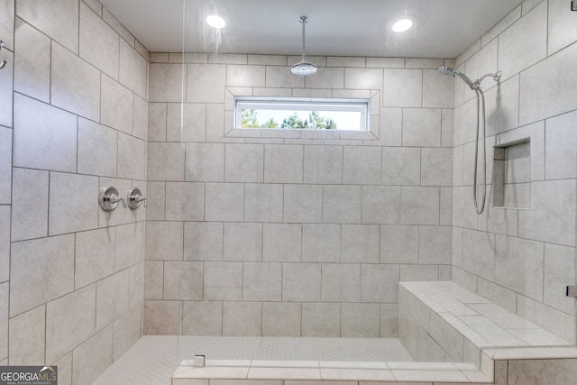 bathroom featuring a tile shower