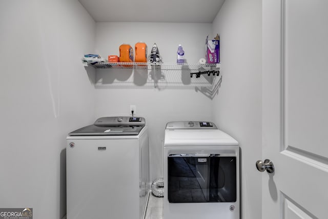 laundry area featuring washer and clothes dryer