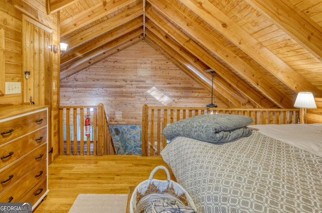 bedroom with wood-type flooring, lofted ceiling with beams, wooden walls, and wood ceiling