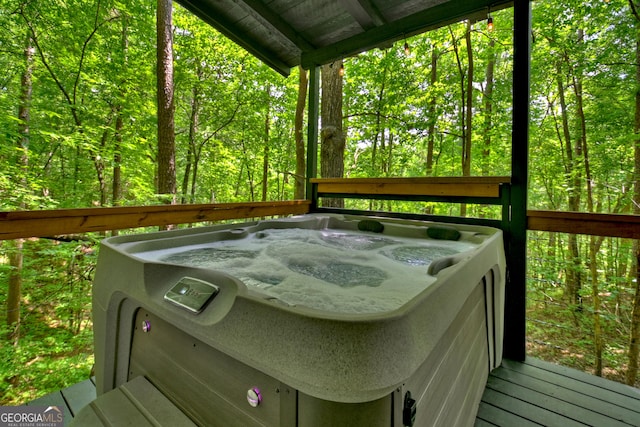 wooden terrace with a hot tub