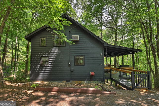 view of home's exterior featuring a wooden deck