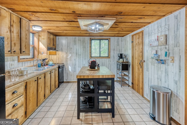 kitchen featuring sink, wooden ceiling, black / electric stove, wooden walls, and light tile patterned flooring