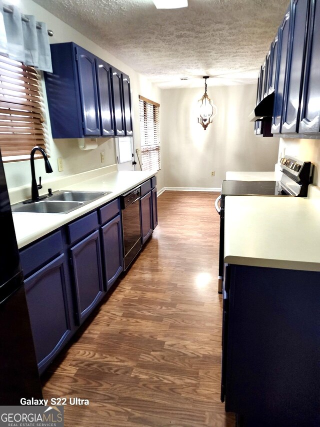 kitchen featuring sink, blue cabinetry, pendant lighting, range, and black dishwasher