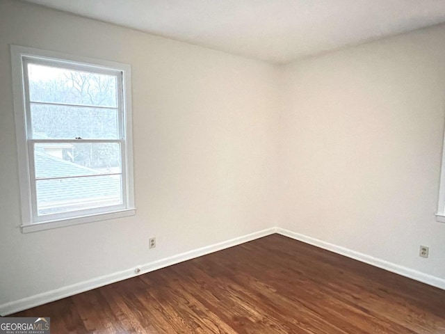 empty room featuring dark hardwood / wood-style floors