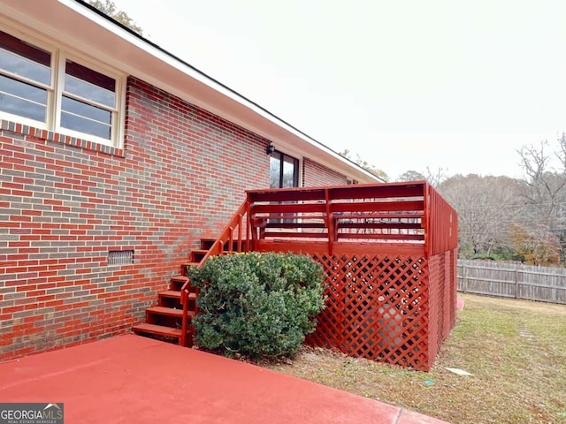 view of side of home with a deck