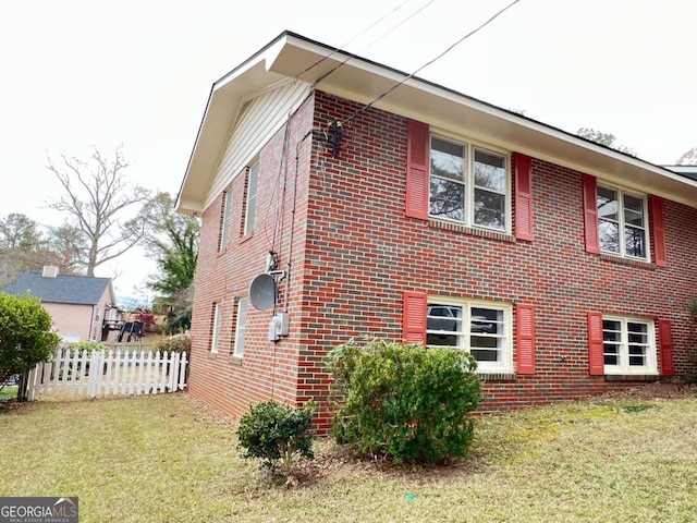 view of home's exterior featuring a yard