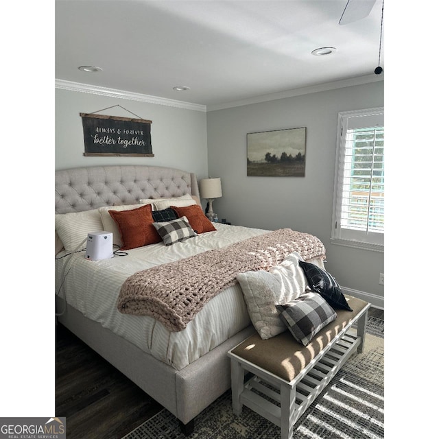 bedroom featuring ornamental molding and dark wood-type flooring