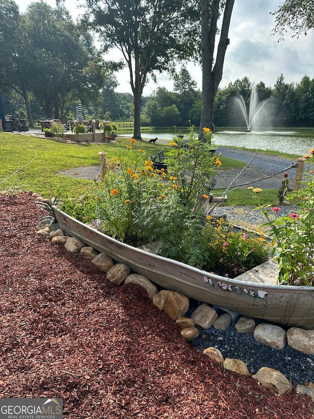 view of yard with a water view