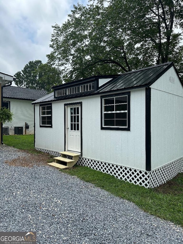 view of outdoor structure featuring central AC unit