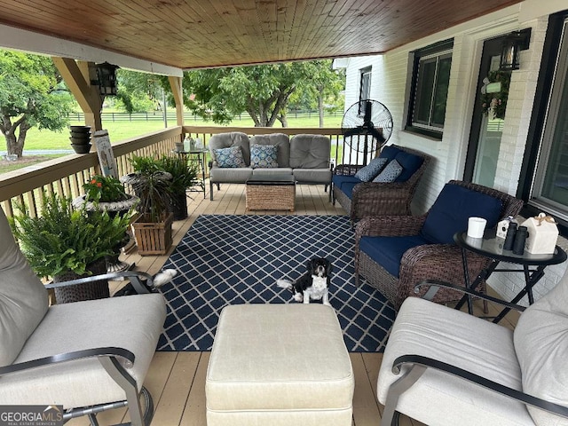 wooden deck with outdoor lounge area