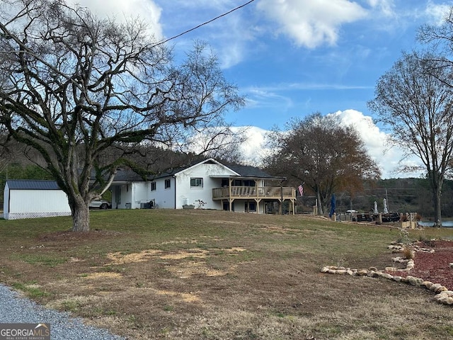 view of yard featuring a wooden deck