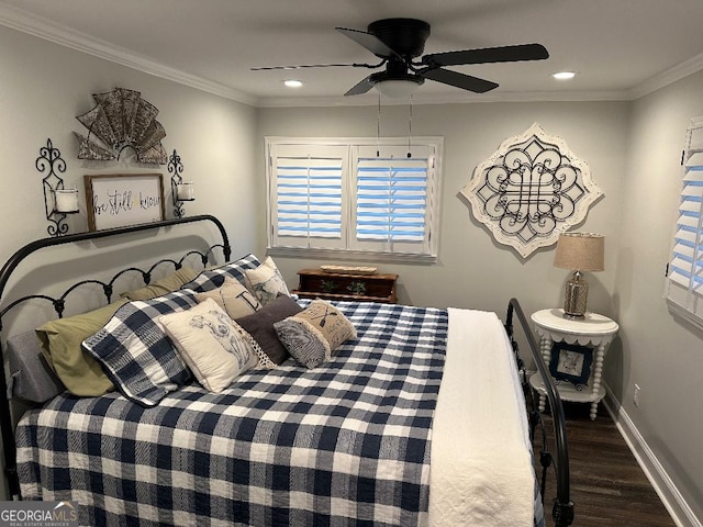 bedroom featuring ornamental molding, dark hardwood / wood-style floors, and ceiling fan