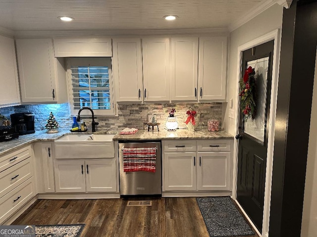 kitchen with white cabinetry, dishwasher, and sink