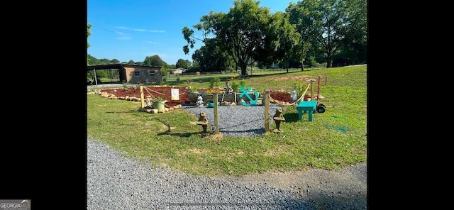 view of jungle gym with a lawn