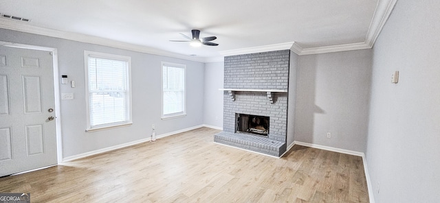 unfurnished living room with a fireplace, light wood-type flooring, ceiling fan, and ornamental molding