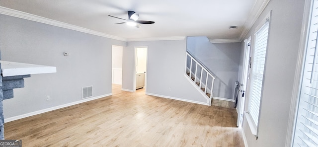 unfurnished living room with ceiling fan, ornamental molding, and light hardwood / wood-style flooring