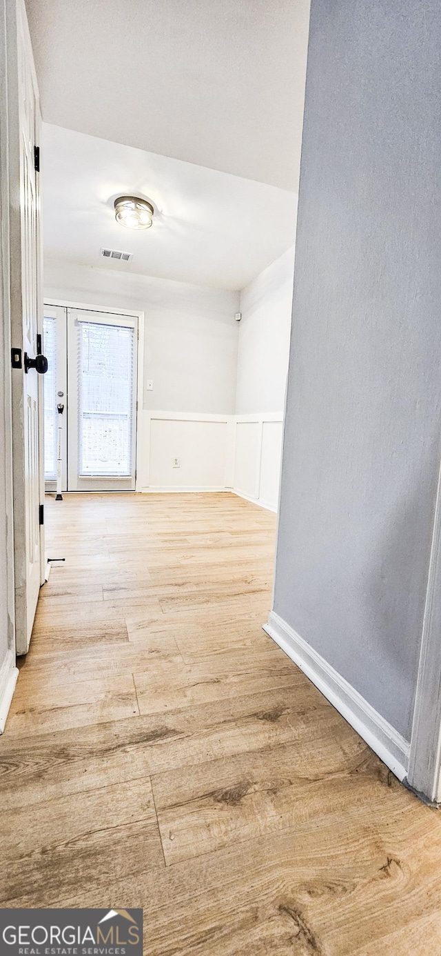 hall with light wood-type flooring