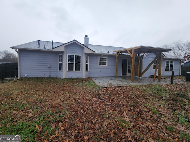 rear view of property featuring a patio