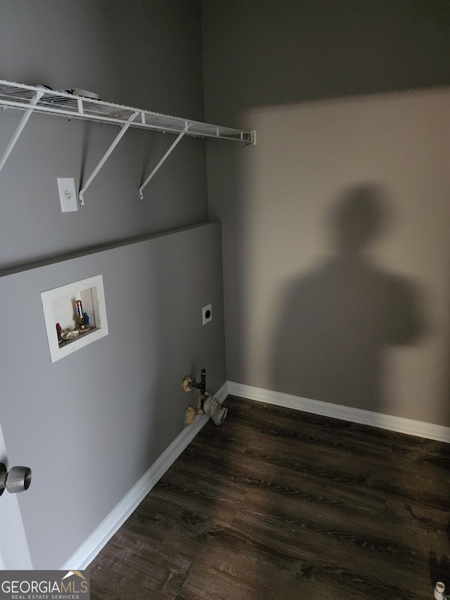 washroom with hookup for an electric dryer, hookup for a washing machine, dark hardwood / wood-style flooring, and hookup for a gas dryer