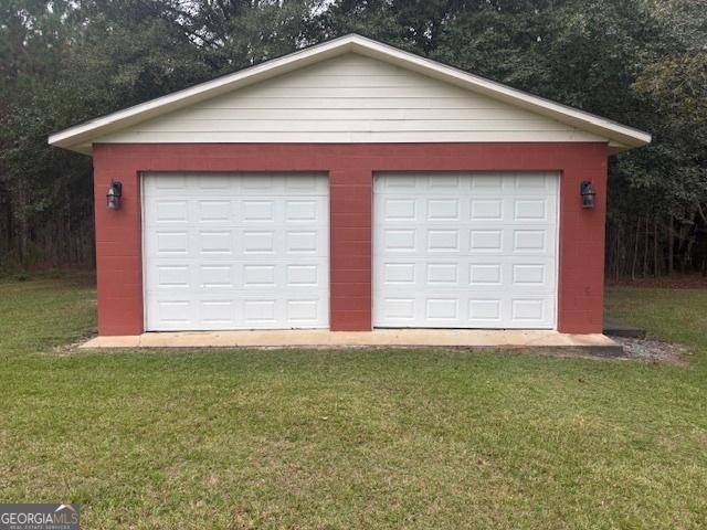 garage with a lawn