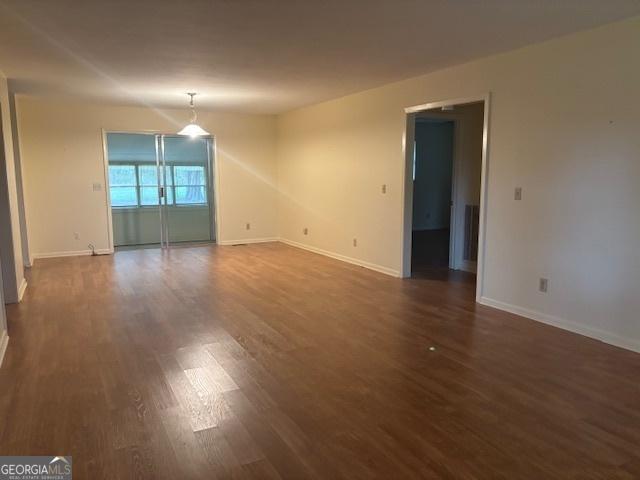 empty room featuring dark hardwood / wood-style floors