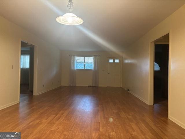 unfurnished living room with hardwood / wood-style flooring