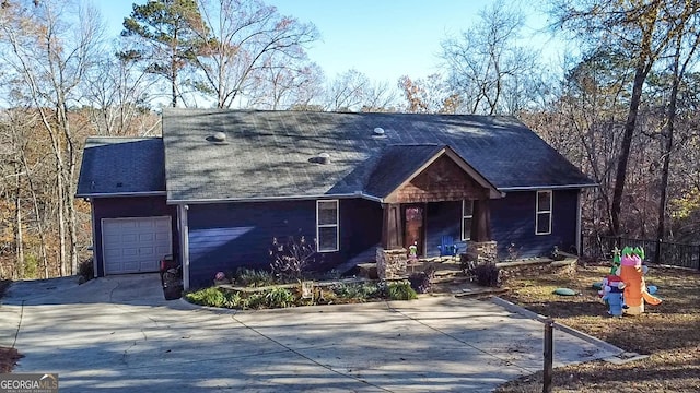 view of front facade with covered porch and a garage