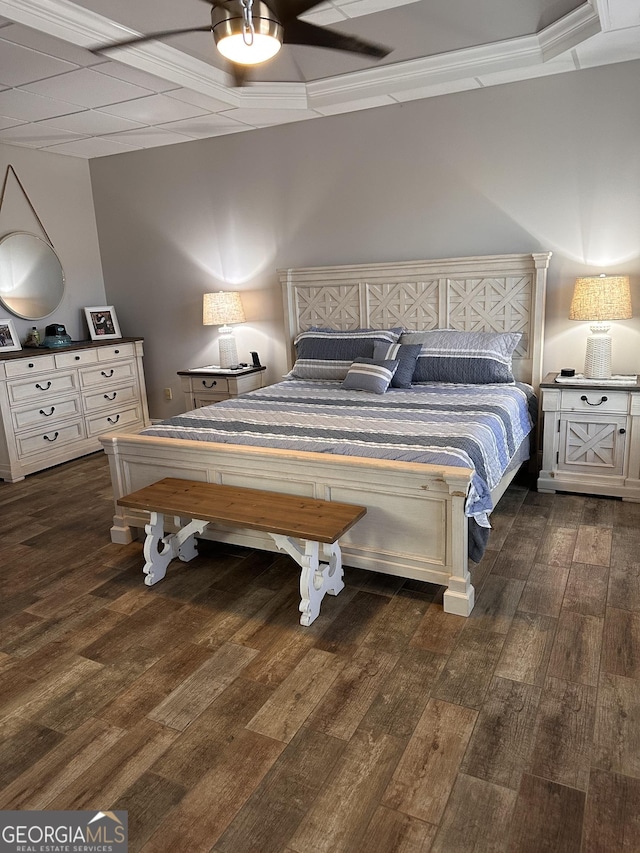 bedroom featuring ceiling fan, dark hardwood / wood-style flooring, and crown molding