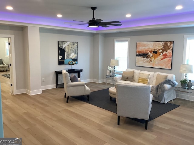 sitting room featuring ceiling fan and light hardwood / wood-style flooring