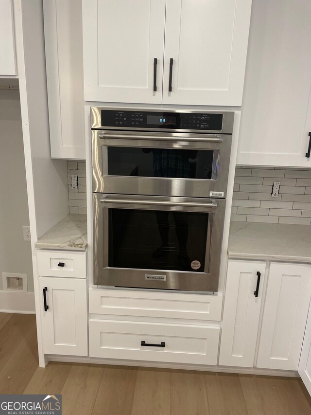 kitchen featuring white cabinetry