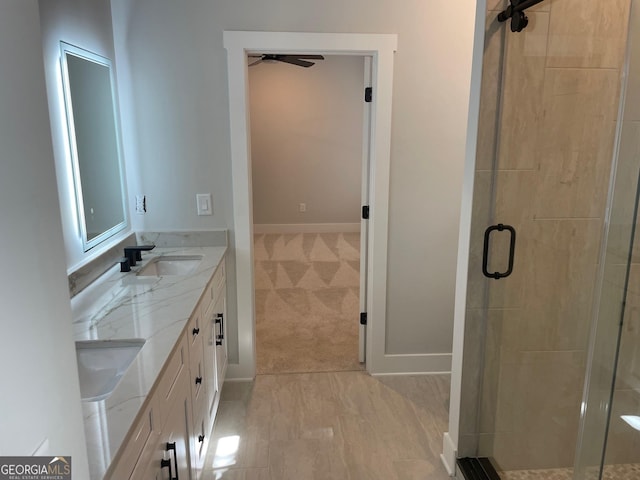 bathroom with vanity and an enclosed shower