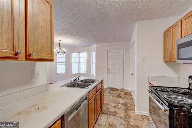 kitchen featuring pendant lighting, sink, a textured ceiling, stainless steel appliances, and a chandelier