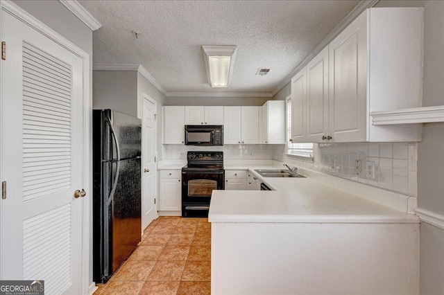 kitchen featuring kitchen peninsula, ornamental molding, black appliances, white cabinets, and light tile patterned flooring