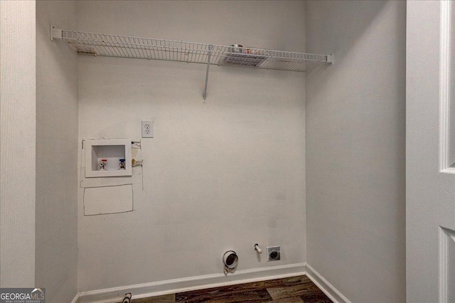 laundry area featuring hookup for an electric dryer, washer hookup, dark hardwood / wood-style floors, and gas dryer hookup