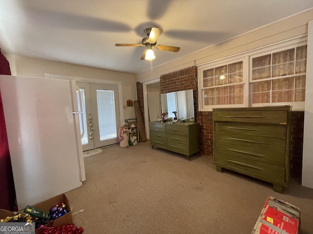 unfurnished bedroom with ceiling fan, french doors, white refrigerator, access to outside, and light carpet