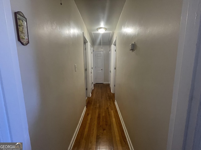 hall with dark wood-type flooring