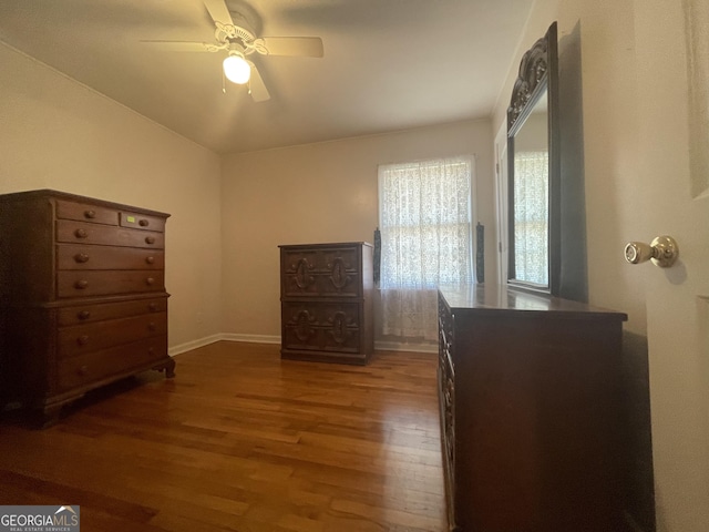 unfurnished bedroom featuring ceiling fan and hardwood / wood-style flooring