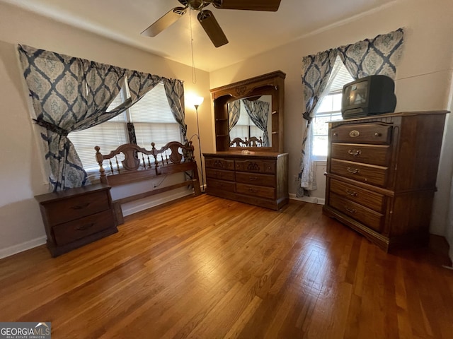 bedroom featuring hardwood / wood-style floors and ceiling fan