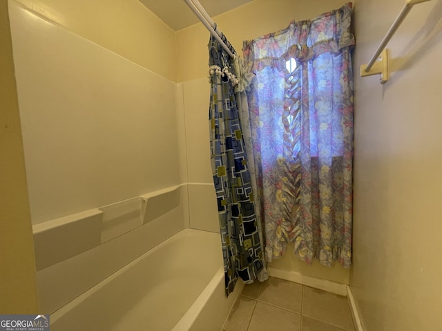 bathroom featuring tile patterned flooring and shower / tub combo with curtain