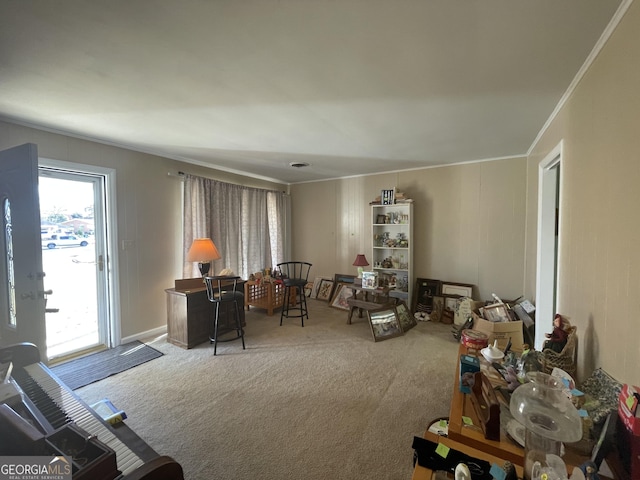 living room featuring ornamental molding and carpet floors