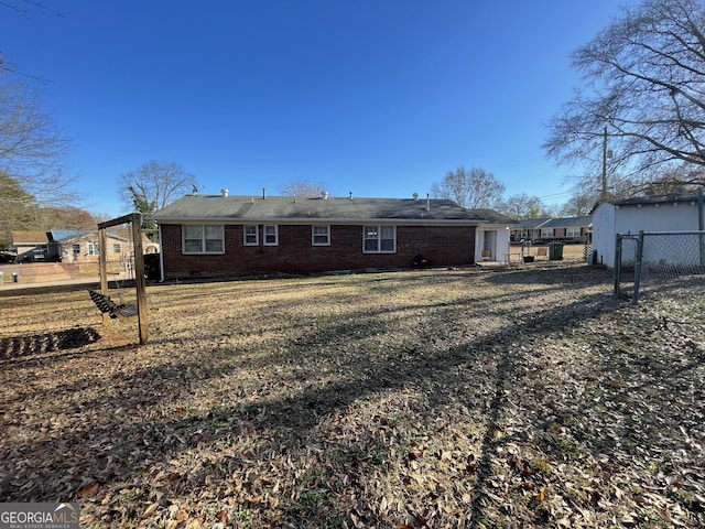 rear view of house with a lawn