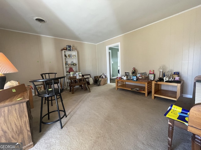 interior space with carpet flooring, crown molding, and wood walls