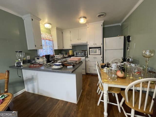 kitchen featuring white cabinetry, white appliances, kitchen peninsula, and dark wood-type flooring