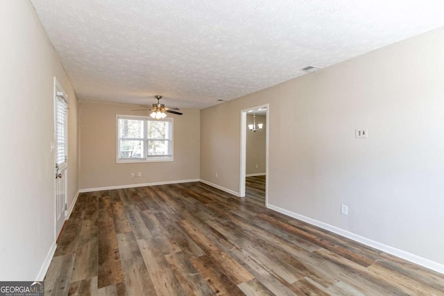 8775 Lee Rd, Lithia Springs, GA 30122 - spare room featuring a textured ceiling, wood finished floors, and a ceiling fan