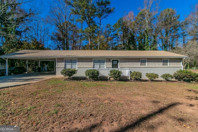 ranch-style home with a carport