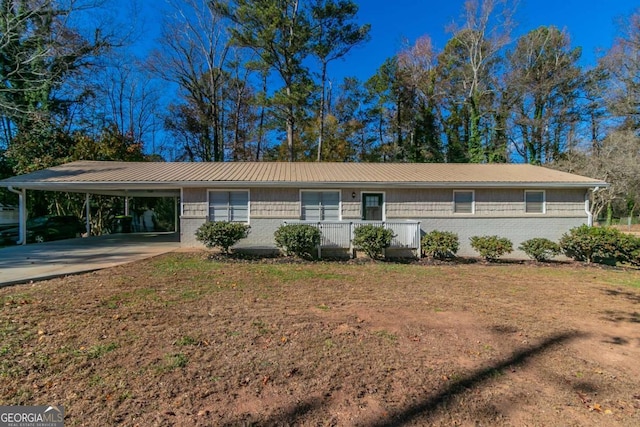 8775 Lee Rd, Lithia Springs, GA 30122 - ranch-style home with an attached carport, concrete driveway, and a metal roof